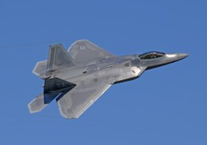 Grey jet aircraft in flight, representing the Darklab Aero X1 ultralight eVTOL