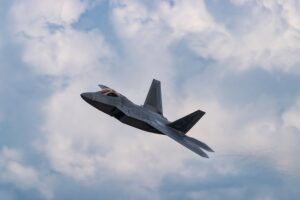 Clean grey aircraft in flight, Darklab Halo executive charter